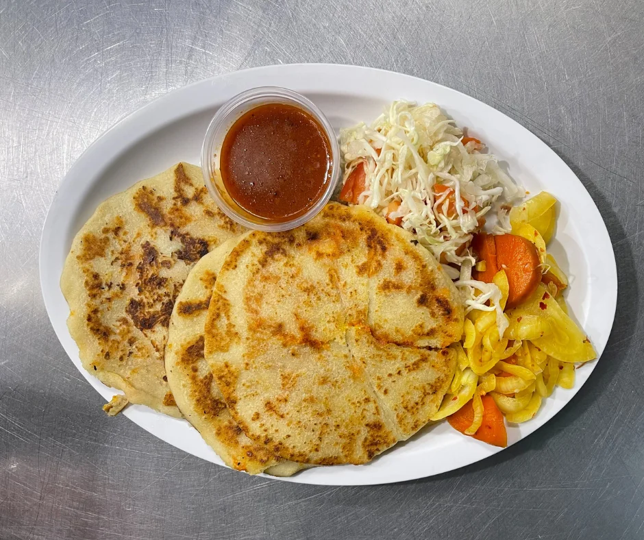 Pupusas - Traditional thick corn tortillas stuffed with savory fillings like beans and cheese.